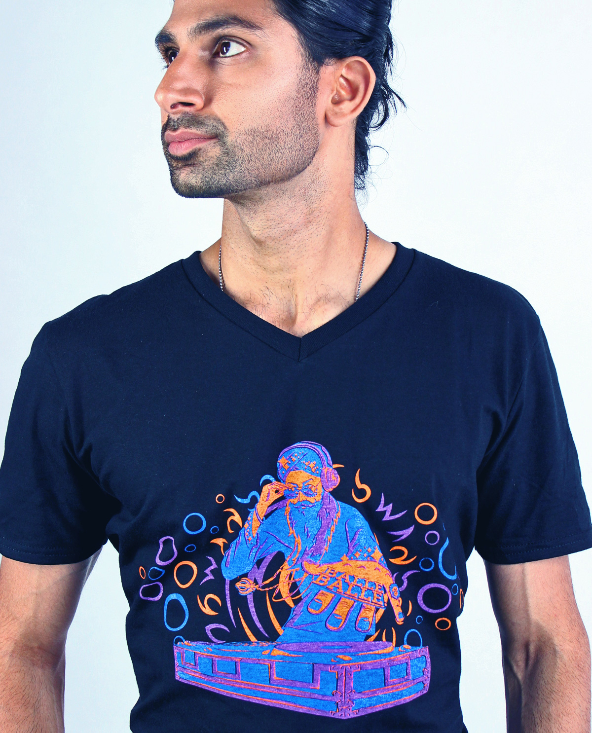 South Asian Male Model wearing full colour graphic design tshirt on black v neck fitted t-shirt by Brown Man Clothing Co.