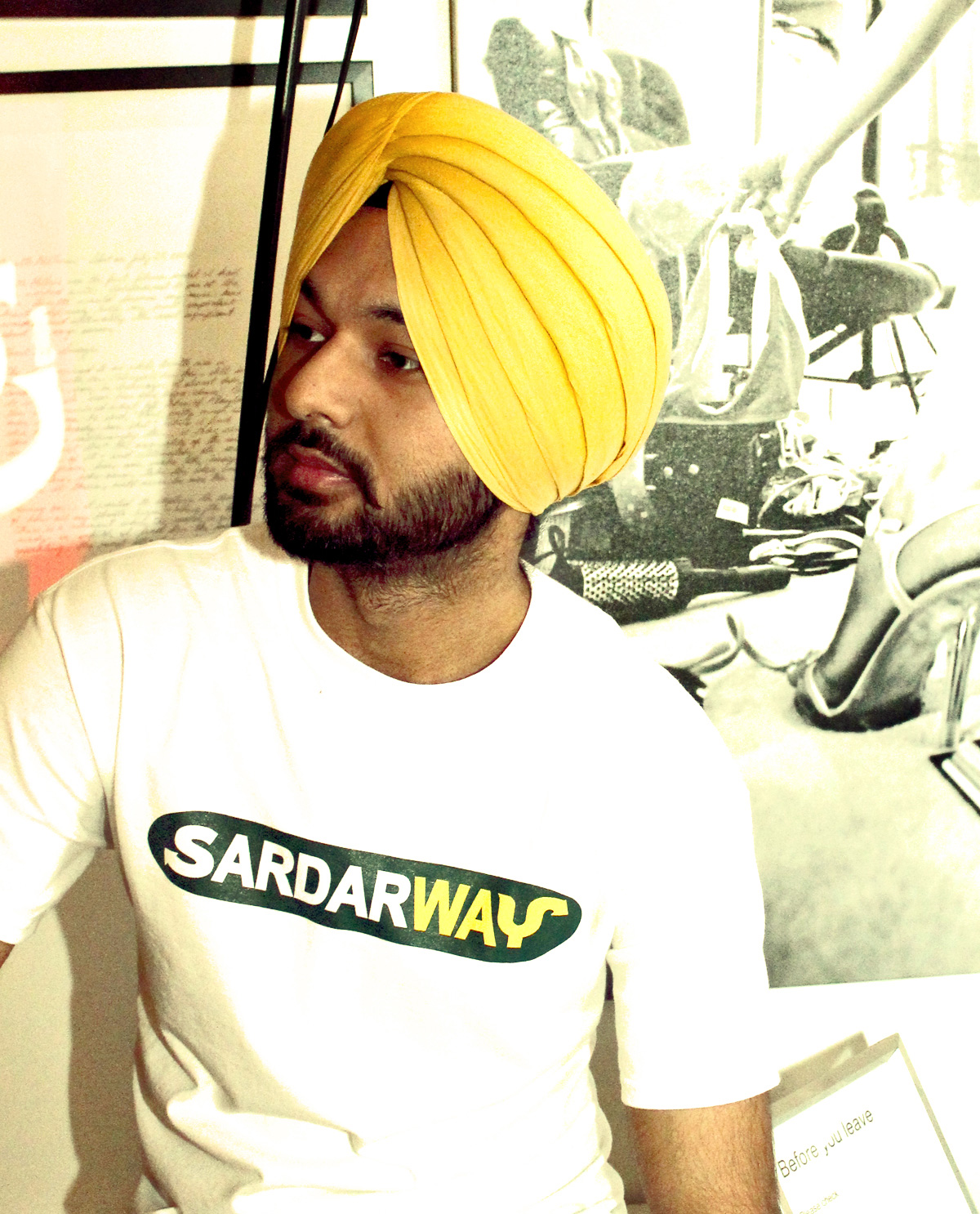 South Asian male model wearing white t.shirt with Graphic Design illustrated design on front that says SardawWay.  South Asian Desi Themed Graphic Design t.shirts by Brown Man Clothing Co.