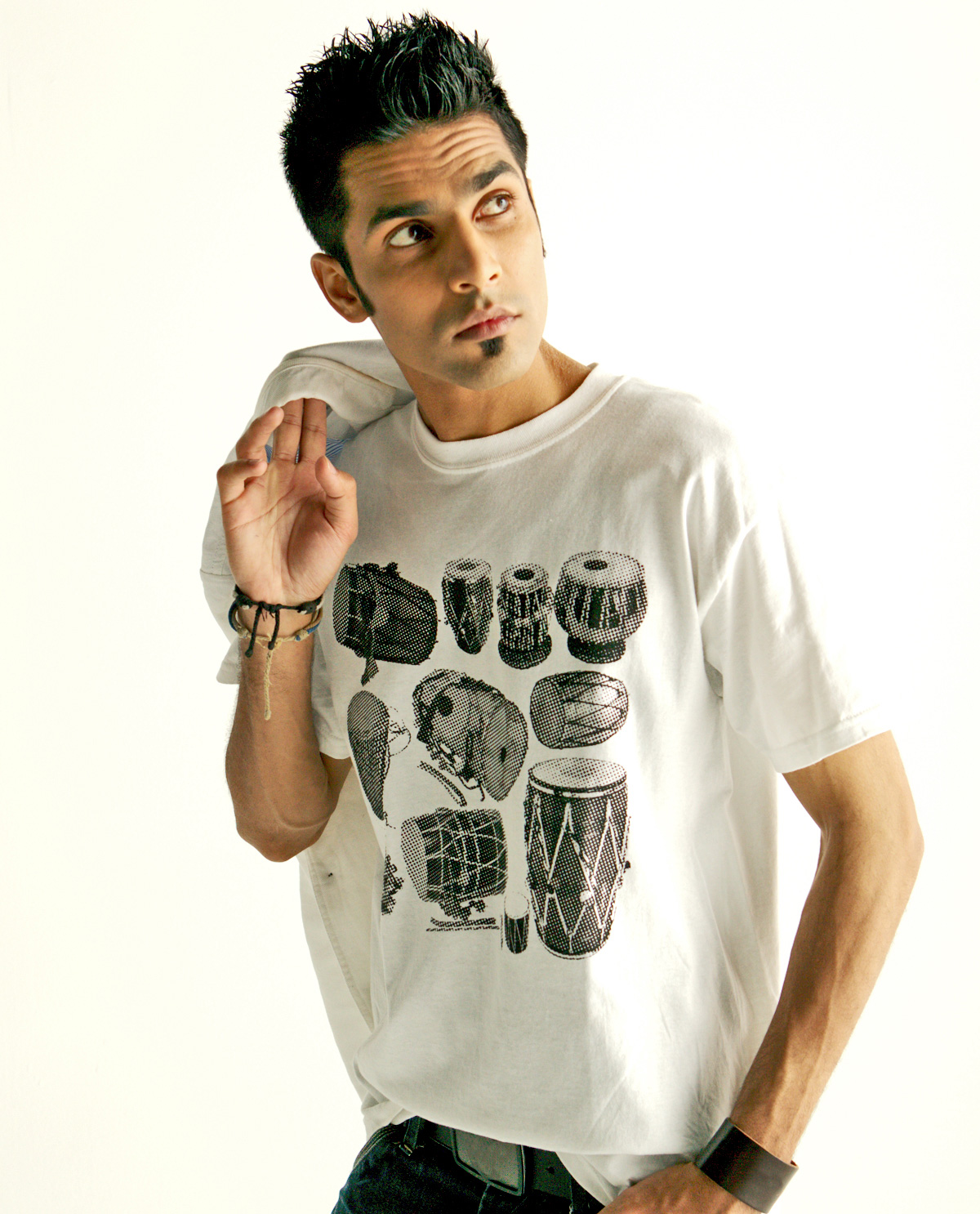 South Asian Male Model wearing white Dhol halftone vintage T.shirt on Black shirt. Graphic design t.shirts by Brown Man Clothing Co.